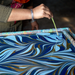 Handmade Indian Cotton Paper- Marbled Fountain Waves- dark blue with light blue and gold- showing the marbling process