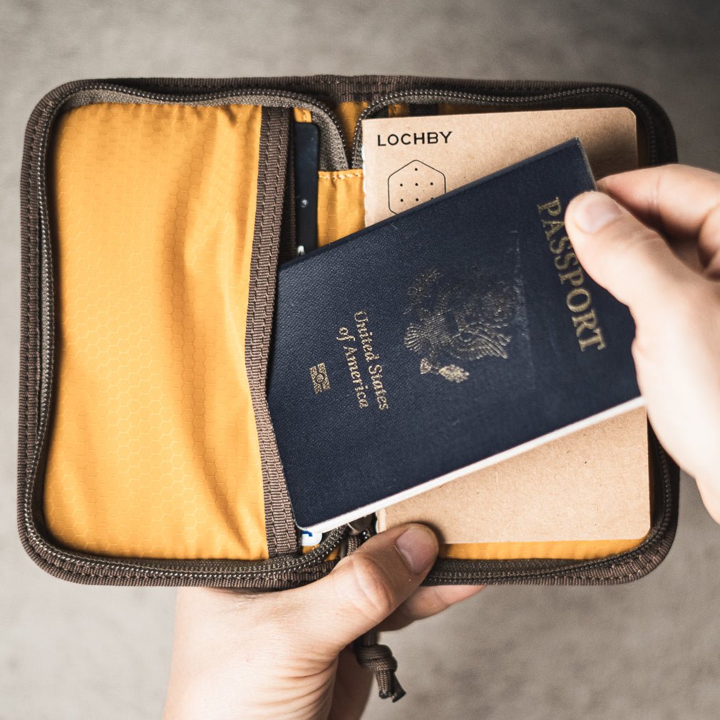 Lochby Pocket Journal in brown shown with passport 