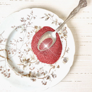 Authentic German Glass Glitter- Red on a vintage plate with spoon