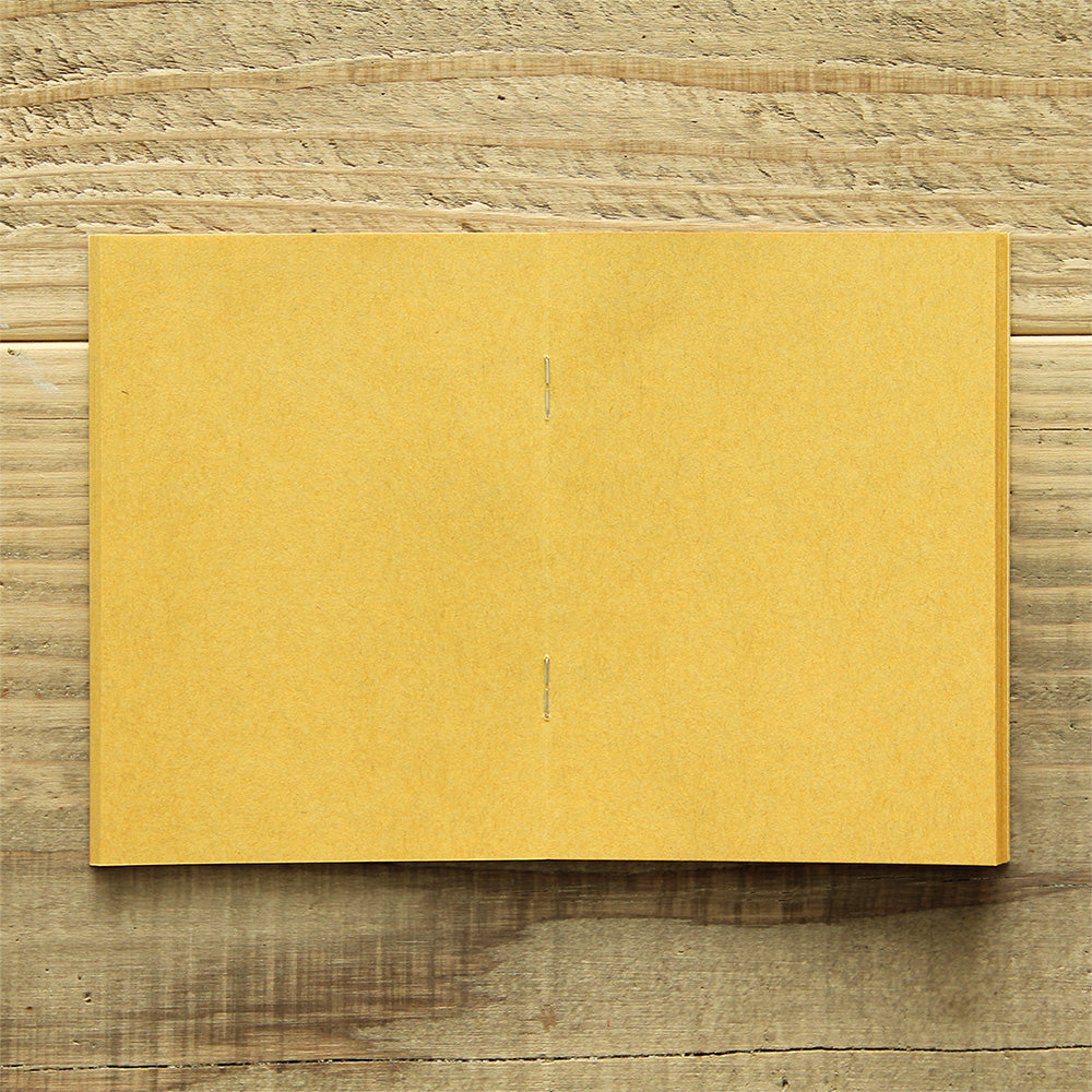 TRAVELER'S FACTORY Passport Refill features yellow kraft paper. 