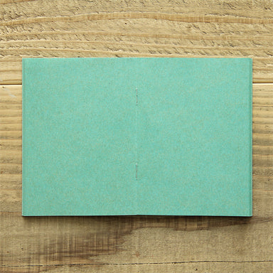 TRAVELER'S FACTORY Passport Refill features turquoise kraft paper. 