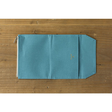 Case has one zipper pocket, one slip pocket with flap, and one slip card pocket
