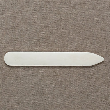 white bone folder shown flat
