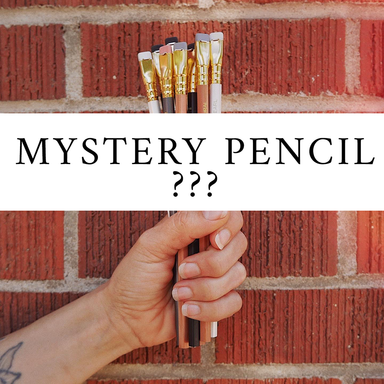 Fist holding pencils in front of brick wall- "Mystery Pencil ???"