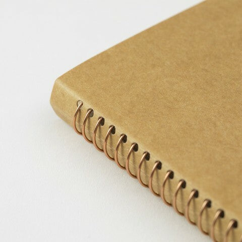 Traveler's Company Spiral Ring Card File Notebook is bound with bronze rings and features a cover made of hearty kraft stock ready for your personal decoration. 