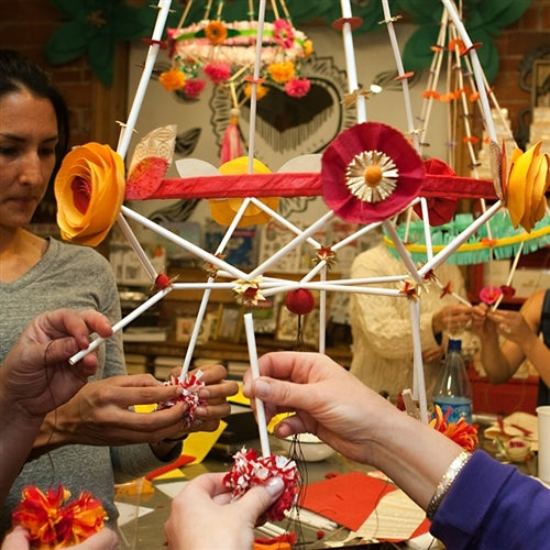 People making a pajak with craft straws