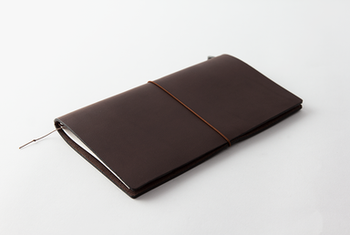 The Regular Size Brown Midori Traveler's Notebook Starter Kit comes with a handmade, cowhide leather cover. 