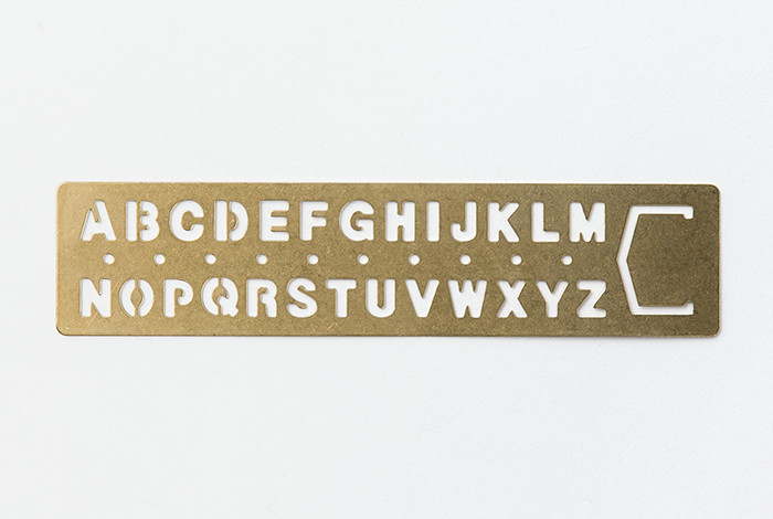 The Midori Traveler's Notebook Alphabet Brass Bookmark will change over time as you use it, making it more personalized.  
