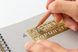 Use the Midori Traveler's Notebook Alphabet Brass Bookmark to make clear letters. 