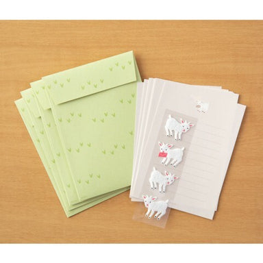 Each set has 4 sheets of paper measuring approximately 4 by 5 1/2 inches, along with four envelopes, and four goat stickers.