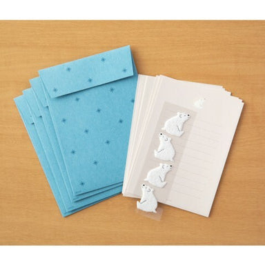 Each set has 4 sheets of paper measuring approximately 4 by 5 1/2 inches, along with four envelopes, and four polar bear stickers.