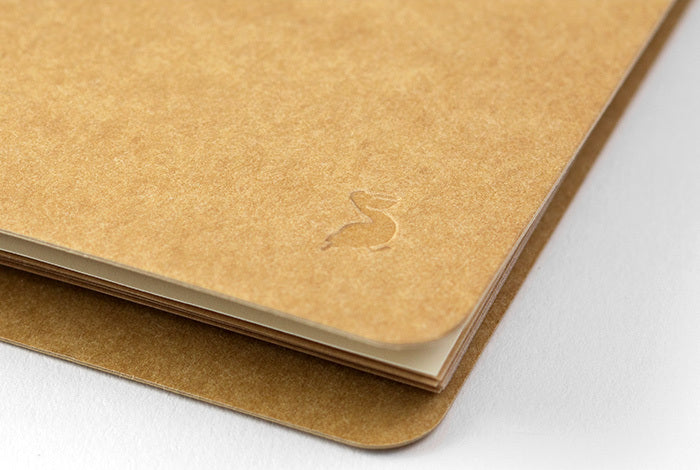 The Midori Spiral Ring Photo File features a cover made of hearty kraft stock ready for your personal decoration.
