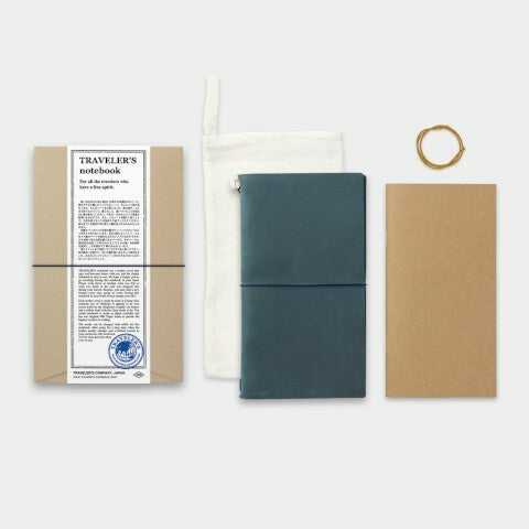 Complete set includes a blue leather cover, a blank notebook refill, a spare rubber band, and a cotton case.